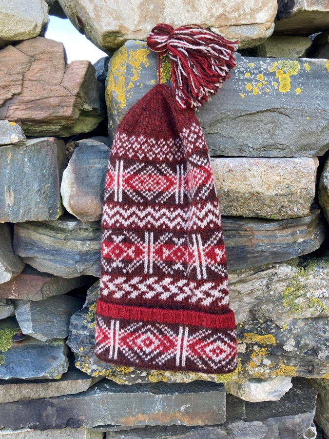 I made my very first flat bed machine knit fair isle hat! : r/knitting